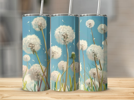 Three tumblers with dandelion fluff against a blue sky background.