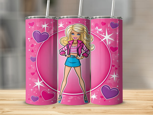 Barbie doll on a pink heart pattern tumbler with straw.