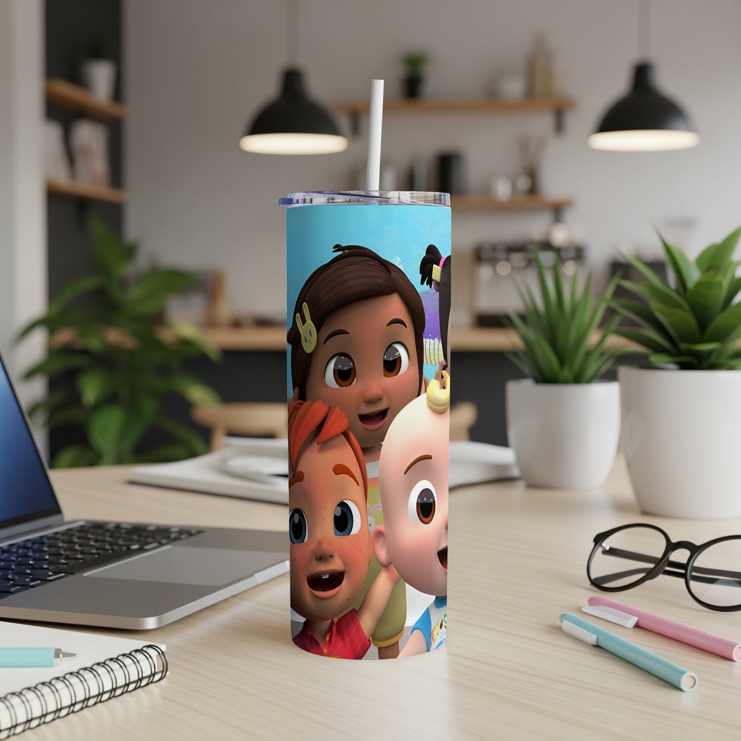 CoComelon characters JJ, TomTom, and YoYo on a blue tumbler with a straw.