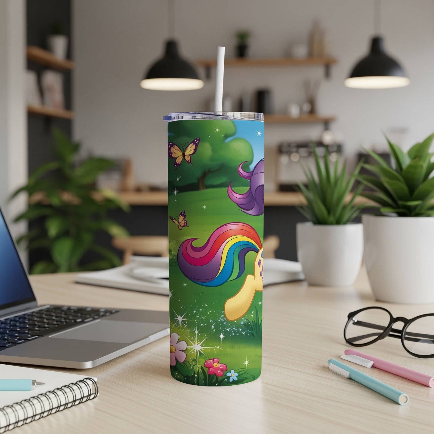 Unicorn with rainbow mane and butterflies in a grassy field.