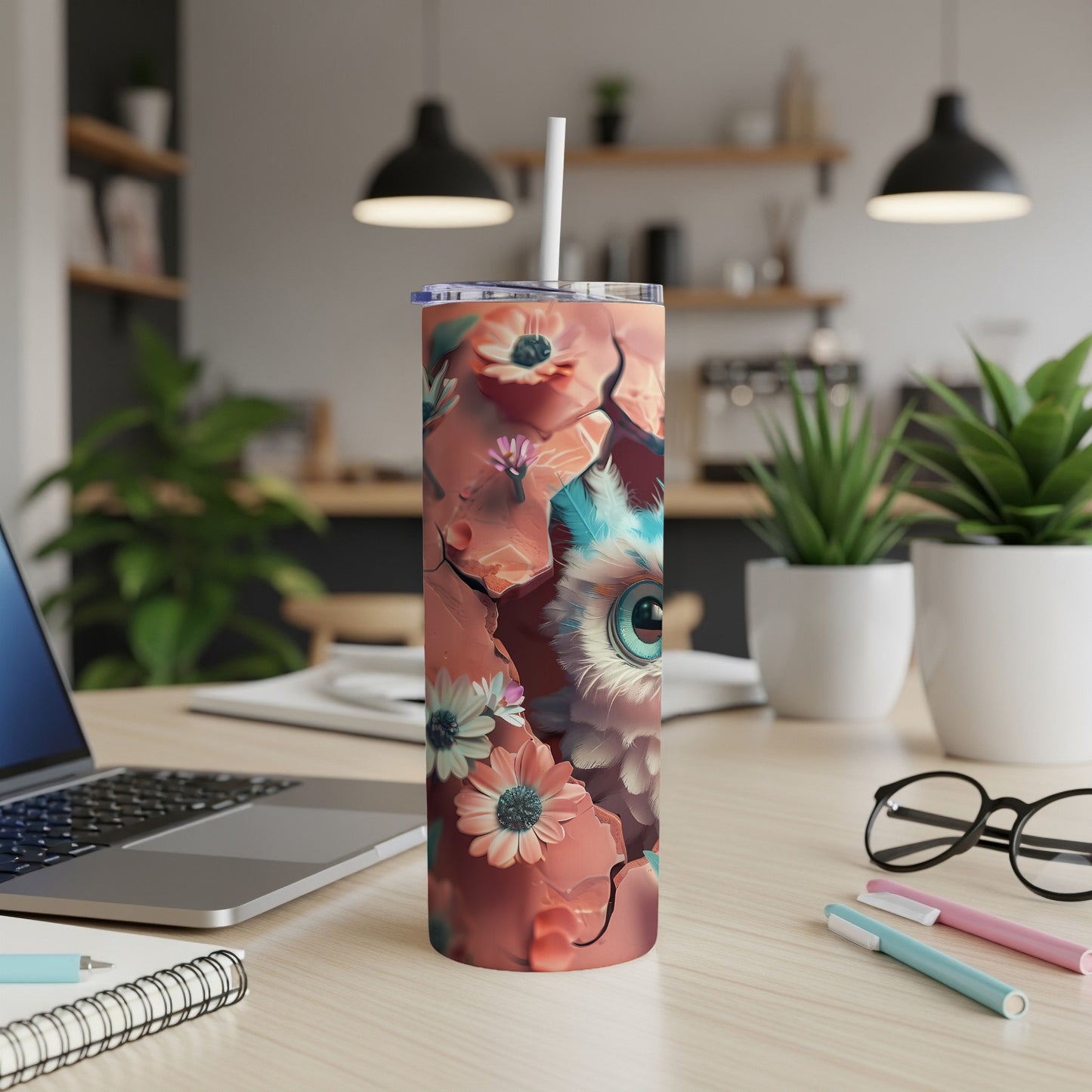 Tumbler with a close-up illustration of a fluffy owl with large blue eyes and floral accents.