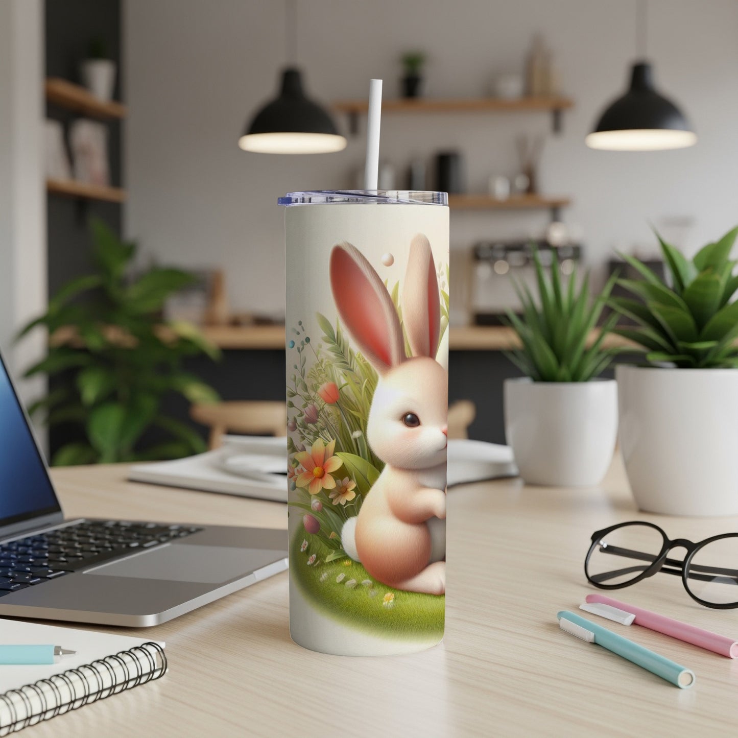 Bunny and flowers on a skinny tumbler with a straw.