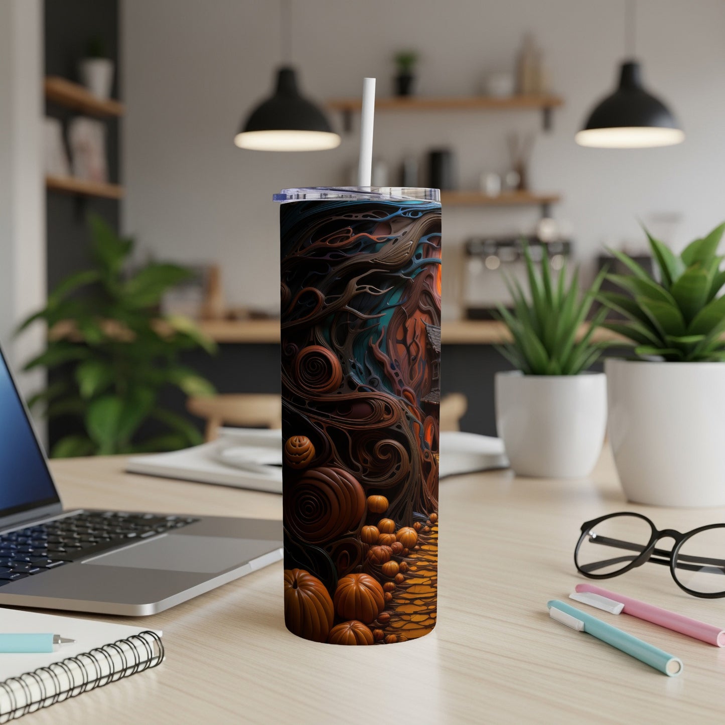 Tall tumbler with abstract Halloween-themed art featuring pumpkins and dark, swirling lines.