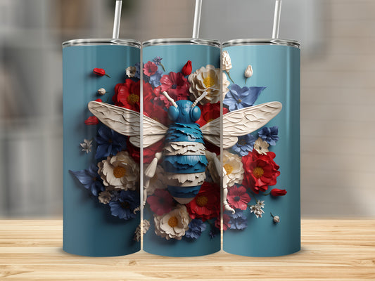 Blue tumbler with a bumblebee and floral design.