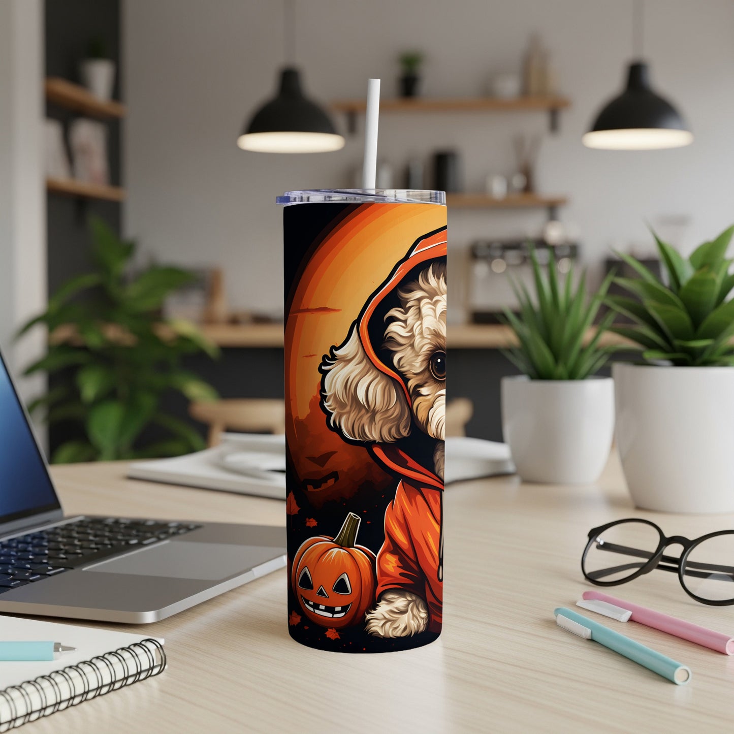 Tumbler with cartoon dog in costume beside a jack-o'-lantern.