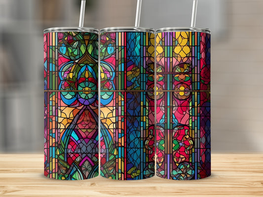 Three stained glass tumblers with colorful, geometric patterns.