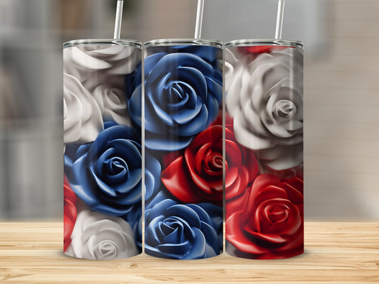 Three tumblers with patriotic red, white, and blue rose designs on a wooden surface.
