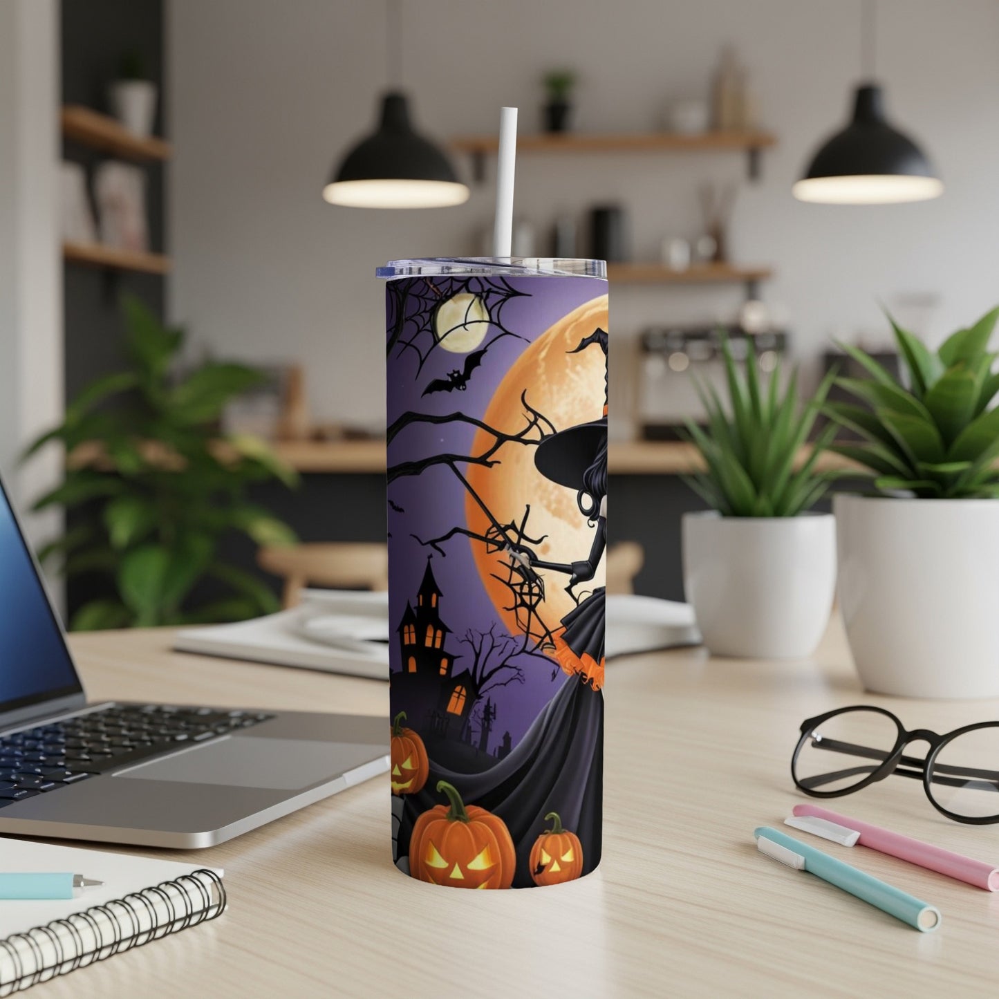 Halloween tumbler with witch, pumpkins, haunted house, bats, and moon.