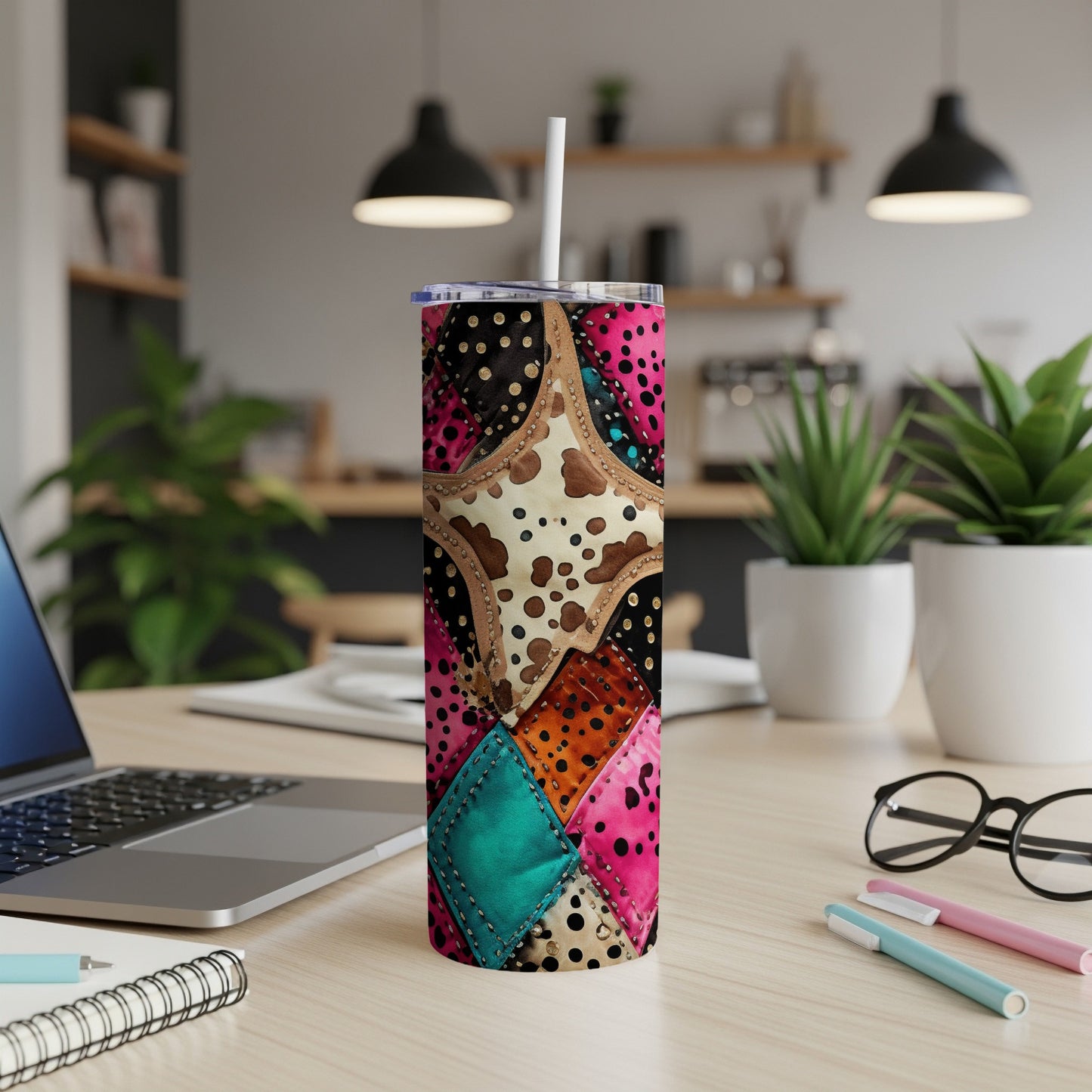 Patchwork tumbler with cow print, polka dots, and teal accents.
