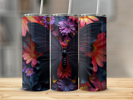 Three tumblers with black butterfly and floral designs stand on a wooden surface.