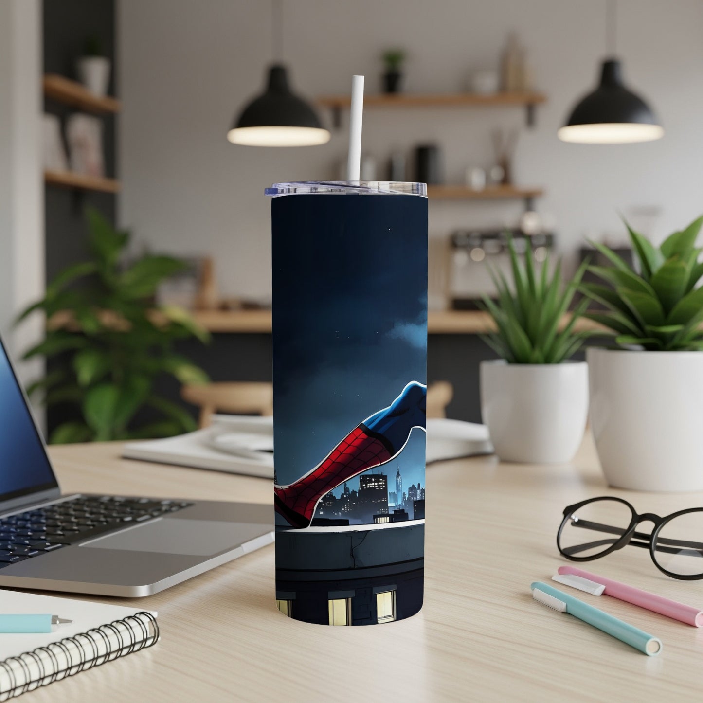 Spider-Man leaning over a city skyline on a dark blue tumbler.