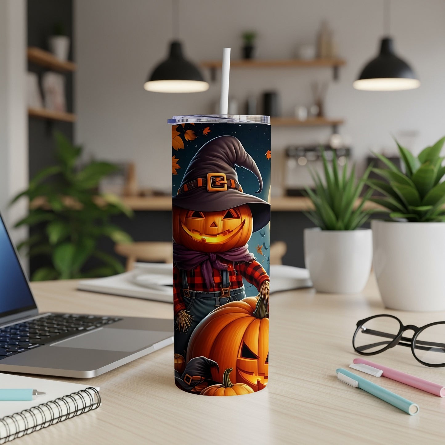 Halloween tumbler with a cartoon scarecrow pumpkin character and pumpkins.