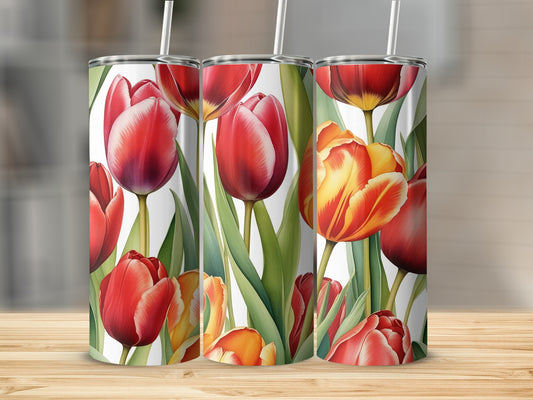 Three tumblers with a close-up floral design of red and yellow tulips.