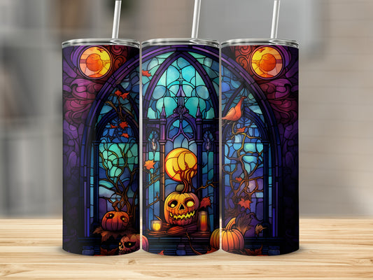 Stained glass Halloween tumblers with pumpkins and a bird against a moonlit background.