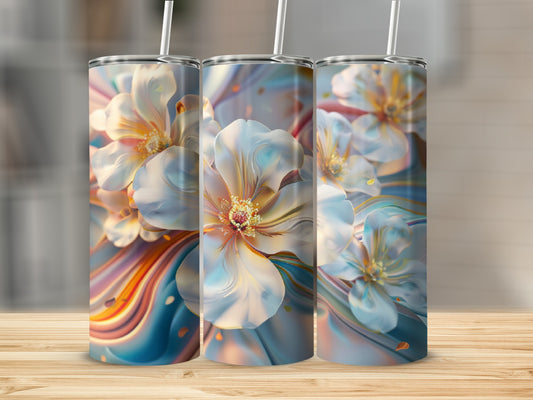 Three tumblers with colorful floral abstract art and straws.