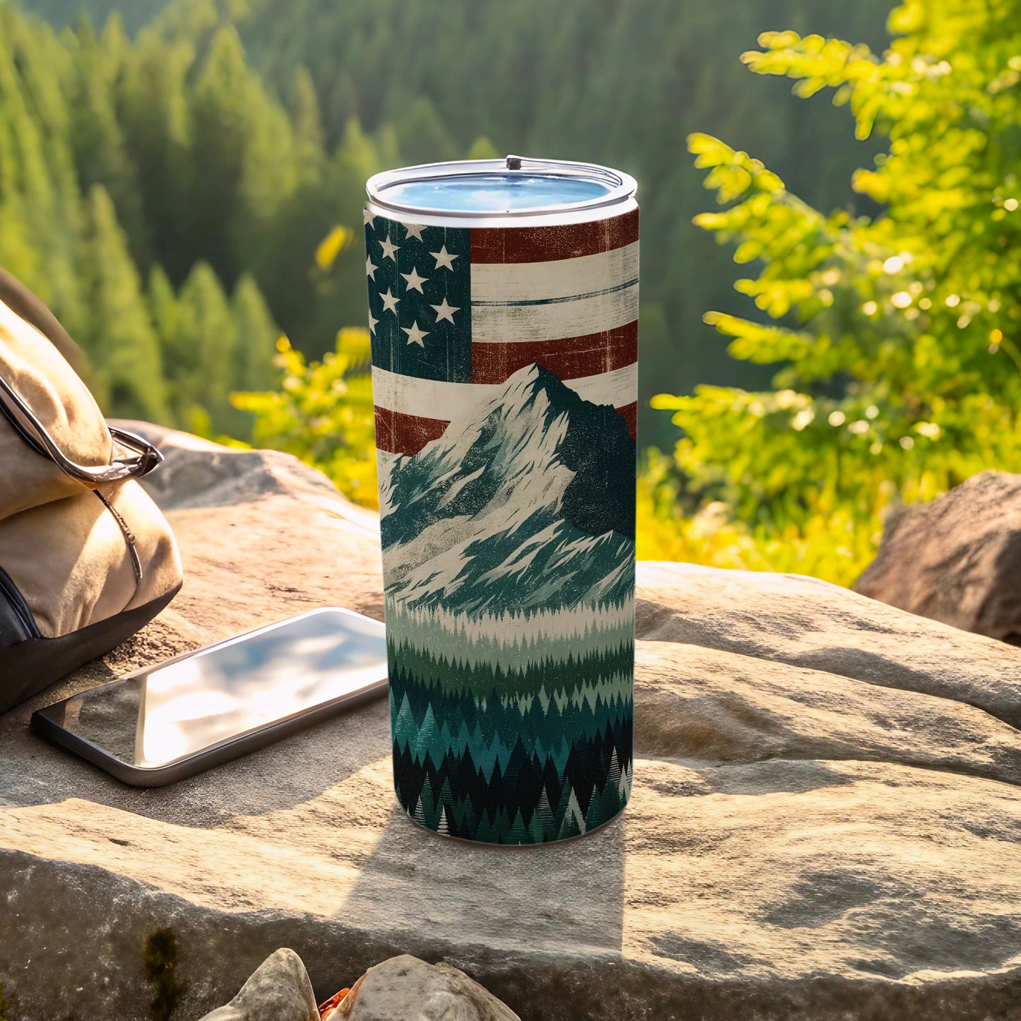 Tumbler with American flag, mountain, and forest scene.
