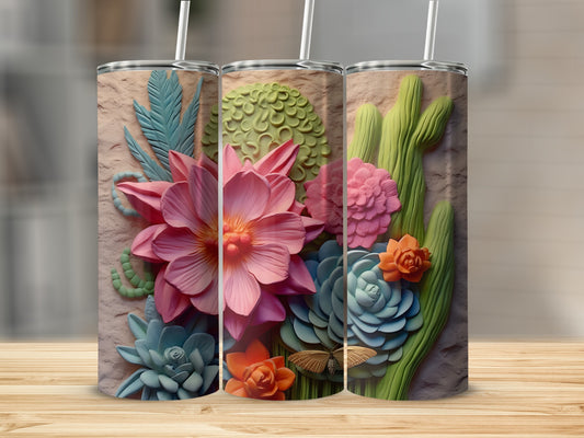 Three textured tumblers with raised floral and cactus designs on a wooden surface.