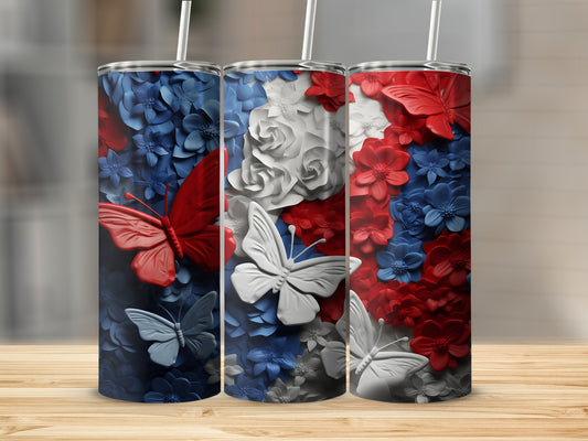 Three patterned tumblers with red, white, and blue floral and butterfly designs.