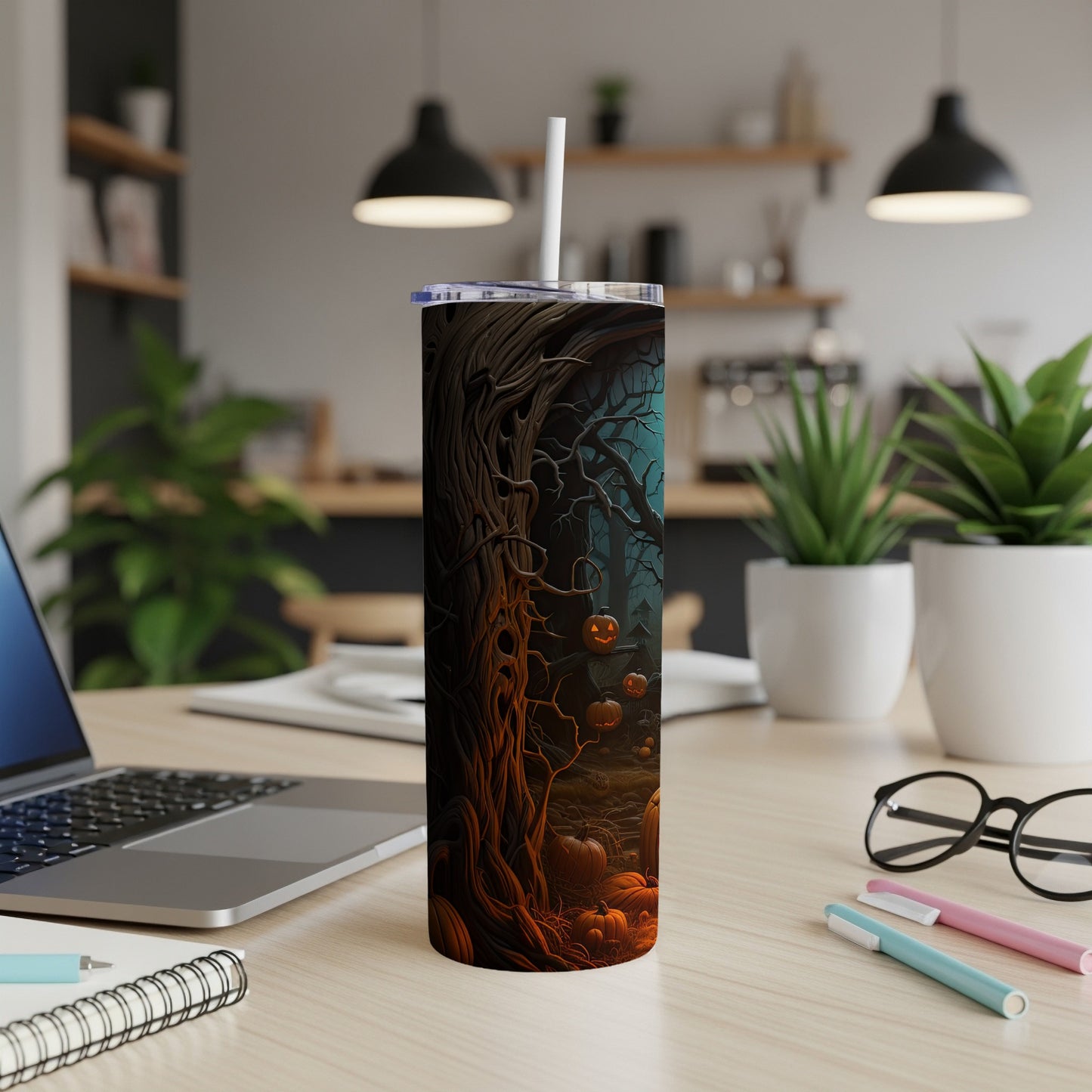 Tumbler with a spooky Halloween forest scene and carved pumpkins design.