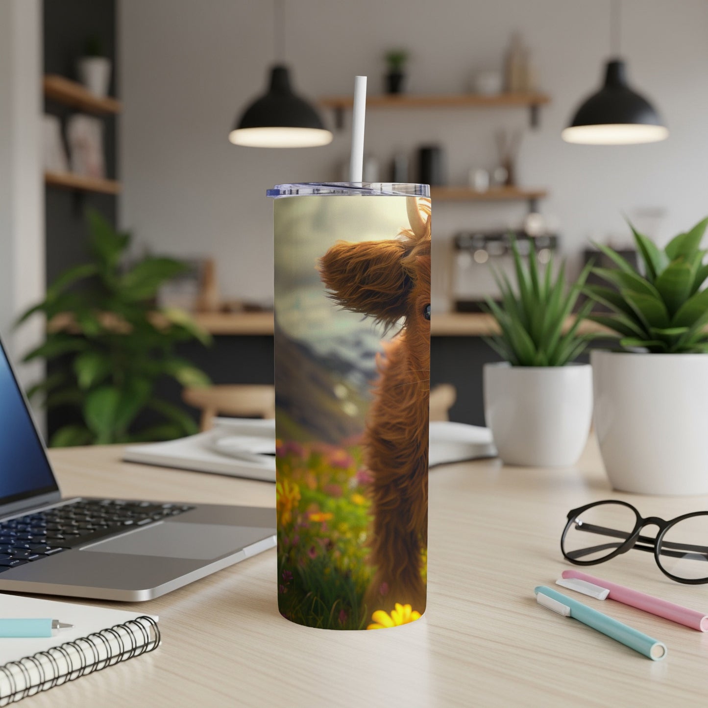 Highland cow on a tumbler with a floral background.