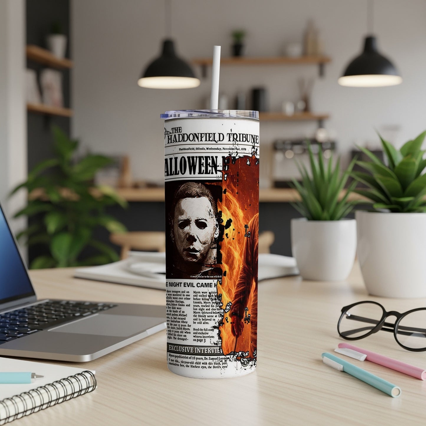 Tumbler with Michael Myers and "The Haddonfield Tribune" headline.