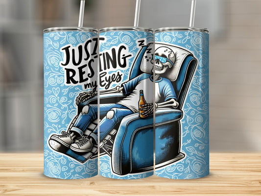 Skeleton in recliner with sunglasses and drink, text "Just Resting My Eyes".
