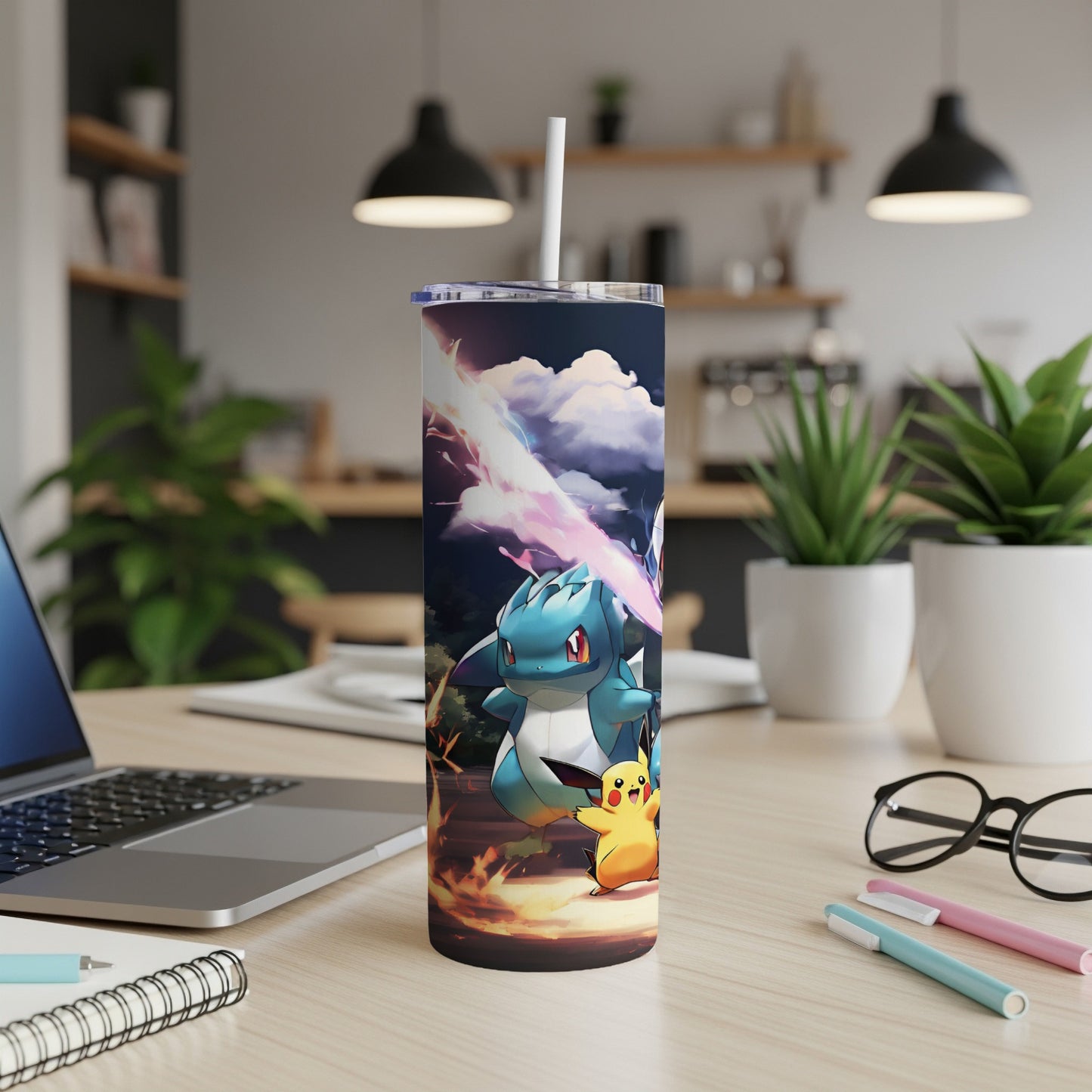 Pokemon tumbler with Pikachu and Feraligatr characters on a wooden desk.