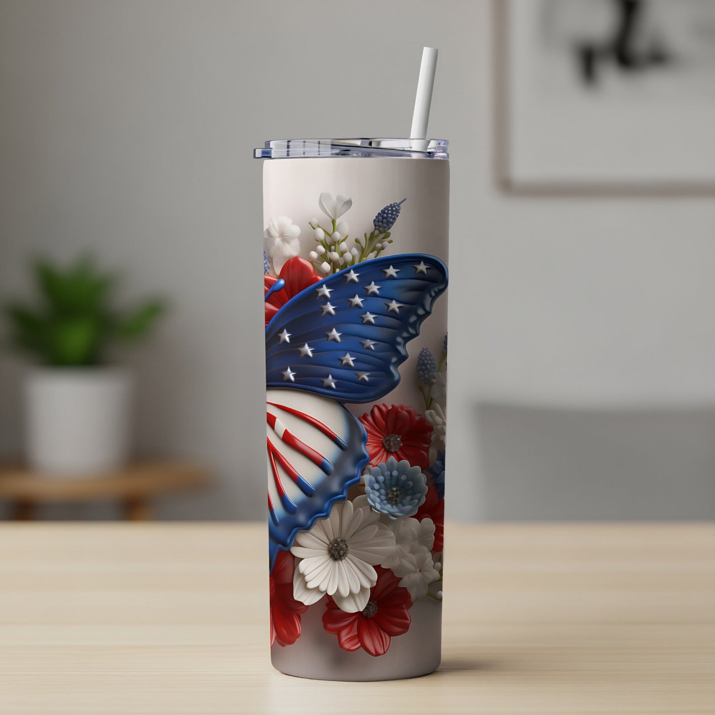 Tall tumbler with patriotic butterfly design and floral accents.