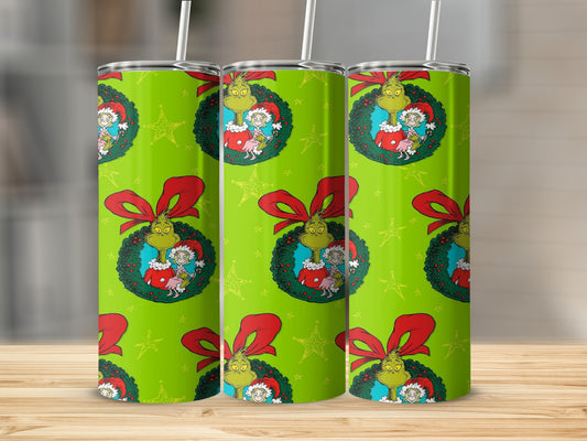 Grinch and Cindy Lou Who in a wreath pattern on a green tumbler.