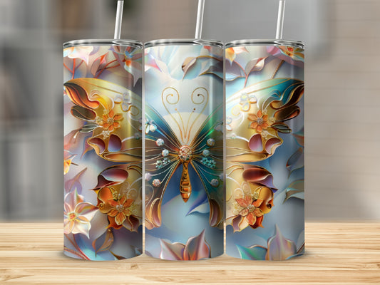 Three tall, patterned tumblers with a colorful butterfly and floral design.