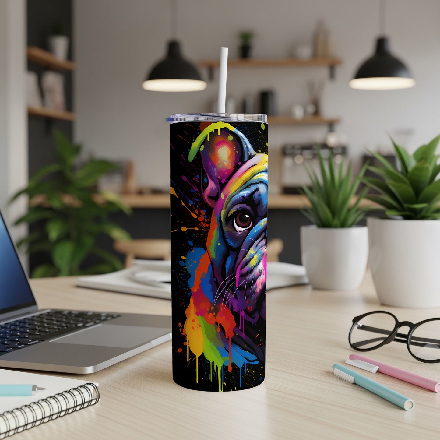 French bulldog face painted with colorful abstract splatters on a black tumbler.