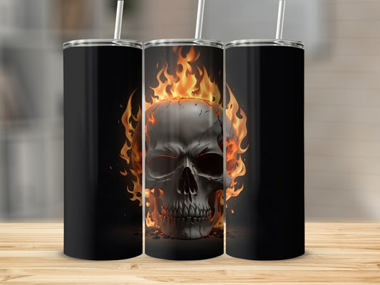 Black tumbler with flaming skull design on a wooden surface.