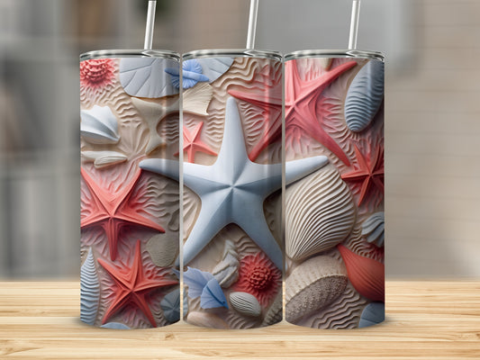 Three tumblers decorated with raised starfish, shells, and sand patterns.