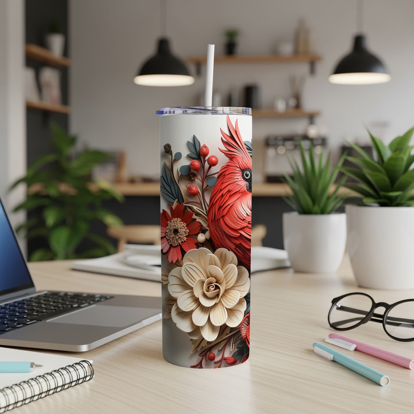 Red cardinal and floral design on a white insulated tumbler.