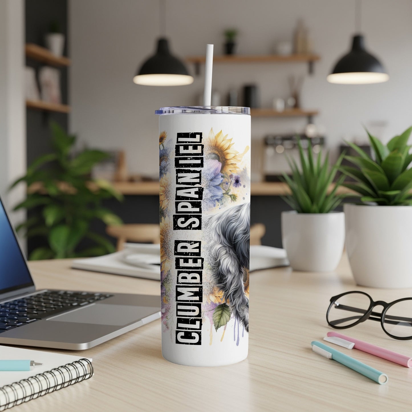 White tumbler with "Clumber Spaniel" text and floral watercolor art.