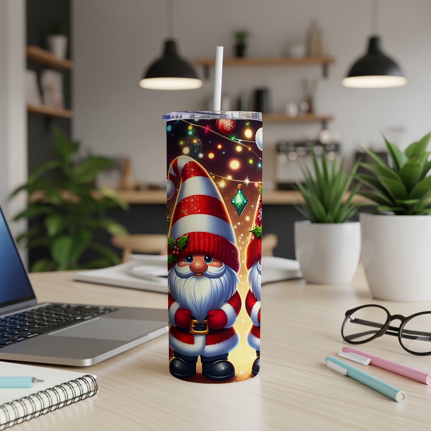 Two gnomes wearing striped hats and Santa suits stand on a desk.