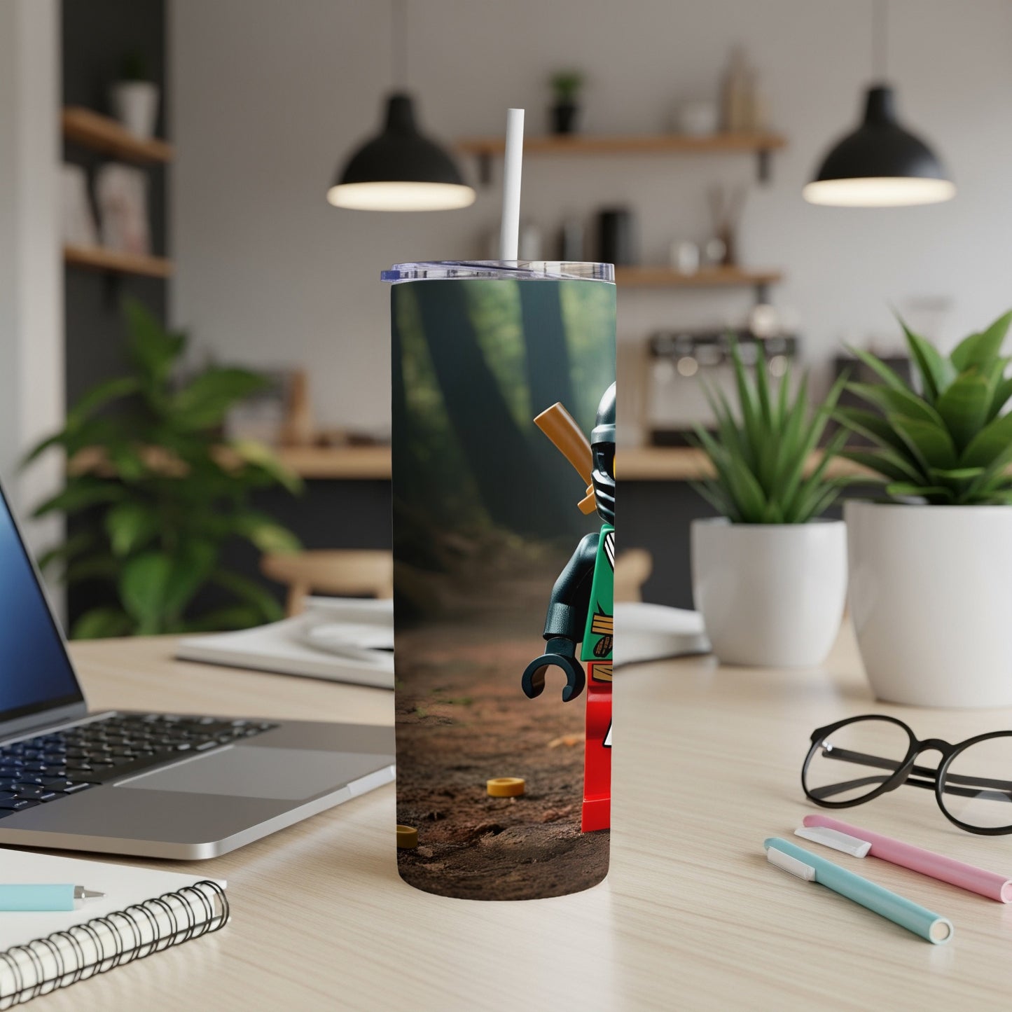 Ninja Lego character with red and green accents on a forest-themed tumbler.