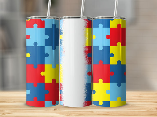 Three tumblers with colorful puzzle piece designs and white abstract splashes.