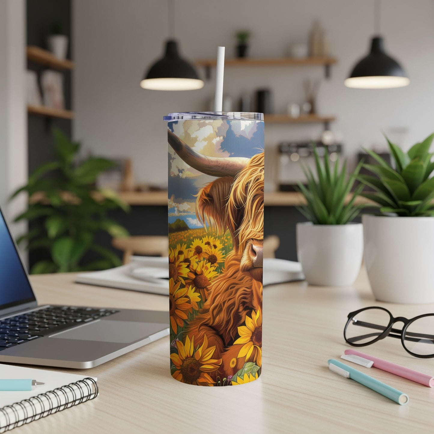 Highland cow in a sunflower field on a white tumbler.
