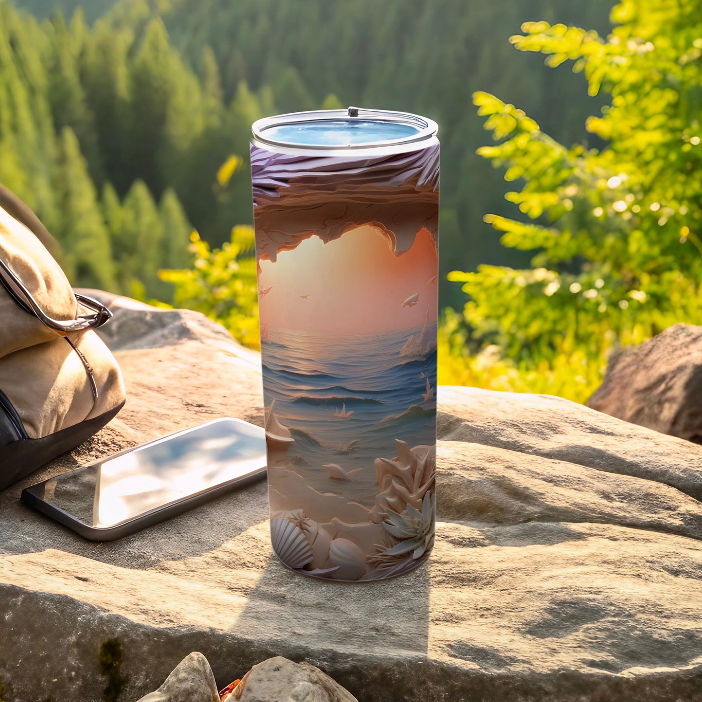 Beach and ocean scene on a stainless steel tumbler with smartphone and backpack.