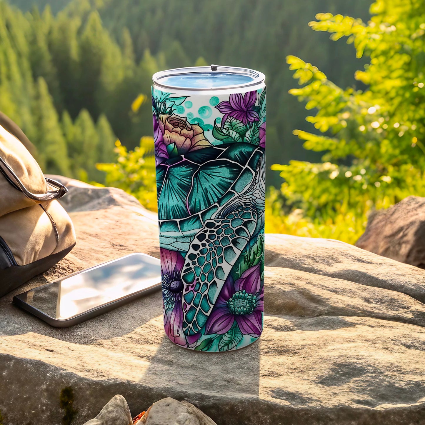Sea turtle and floral design on a tall blue and teal tumbler.