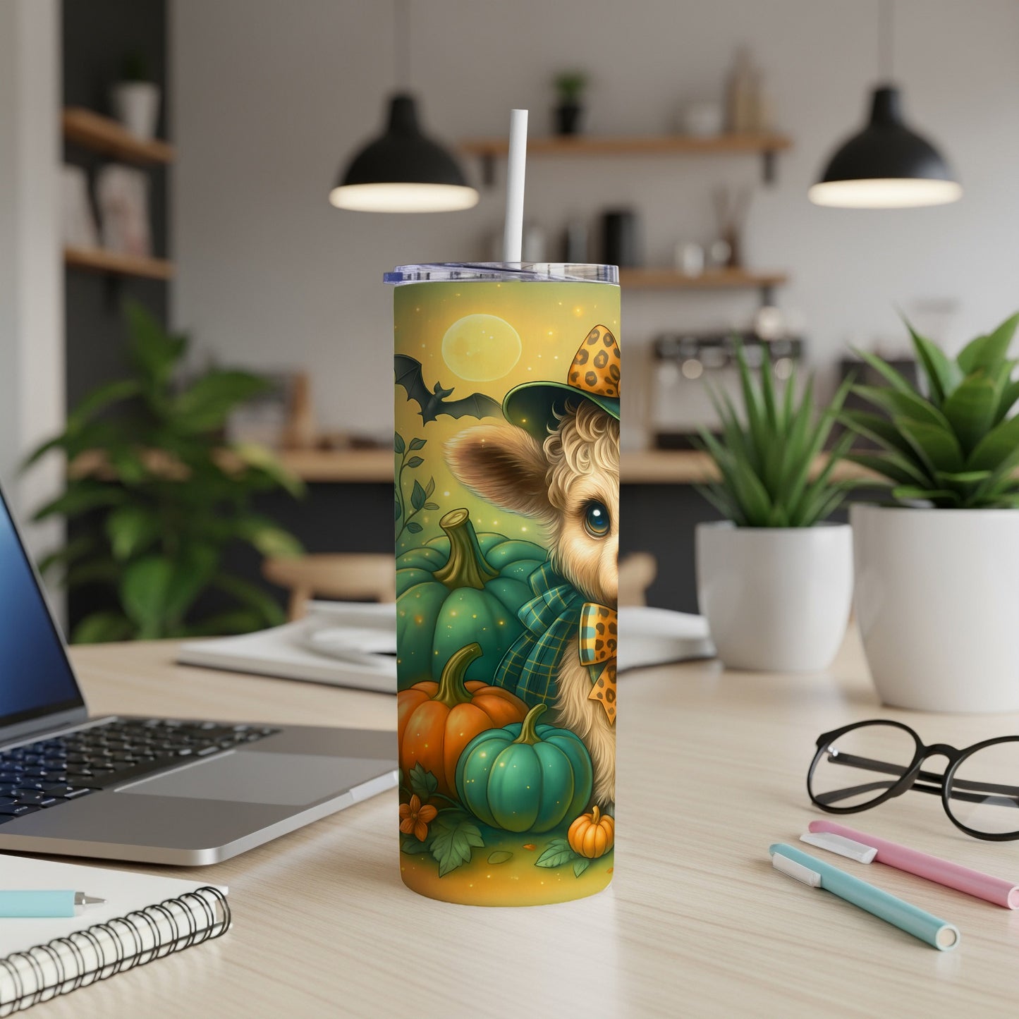 Tumbler with witch hat cow, pumpkins, bats, and a full moon.
