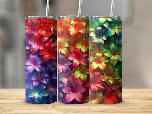 Three colorful floral tumblers with ombre flower patterns.