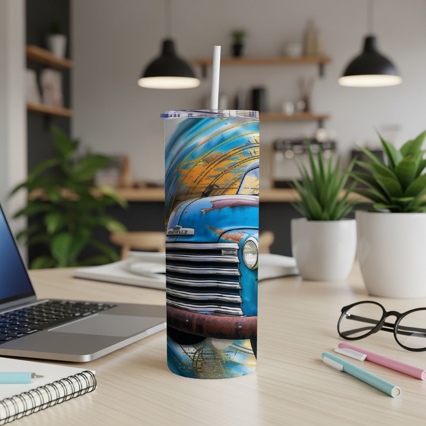 Blue vintage pickup truck with abstract orange and blue background on a tumbler.