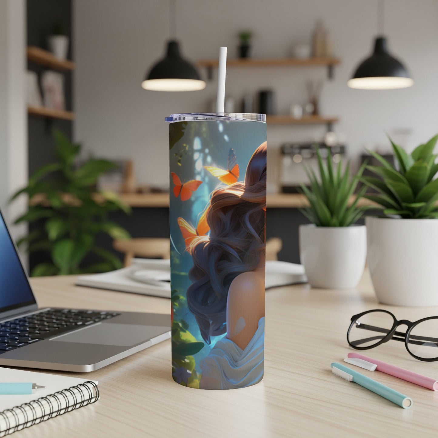 Tumbler with woman and butterflies, on a desk.