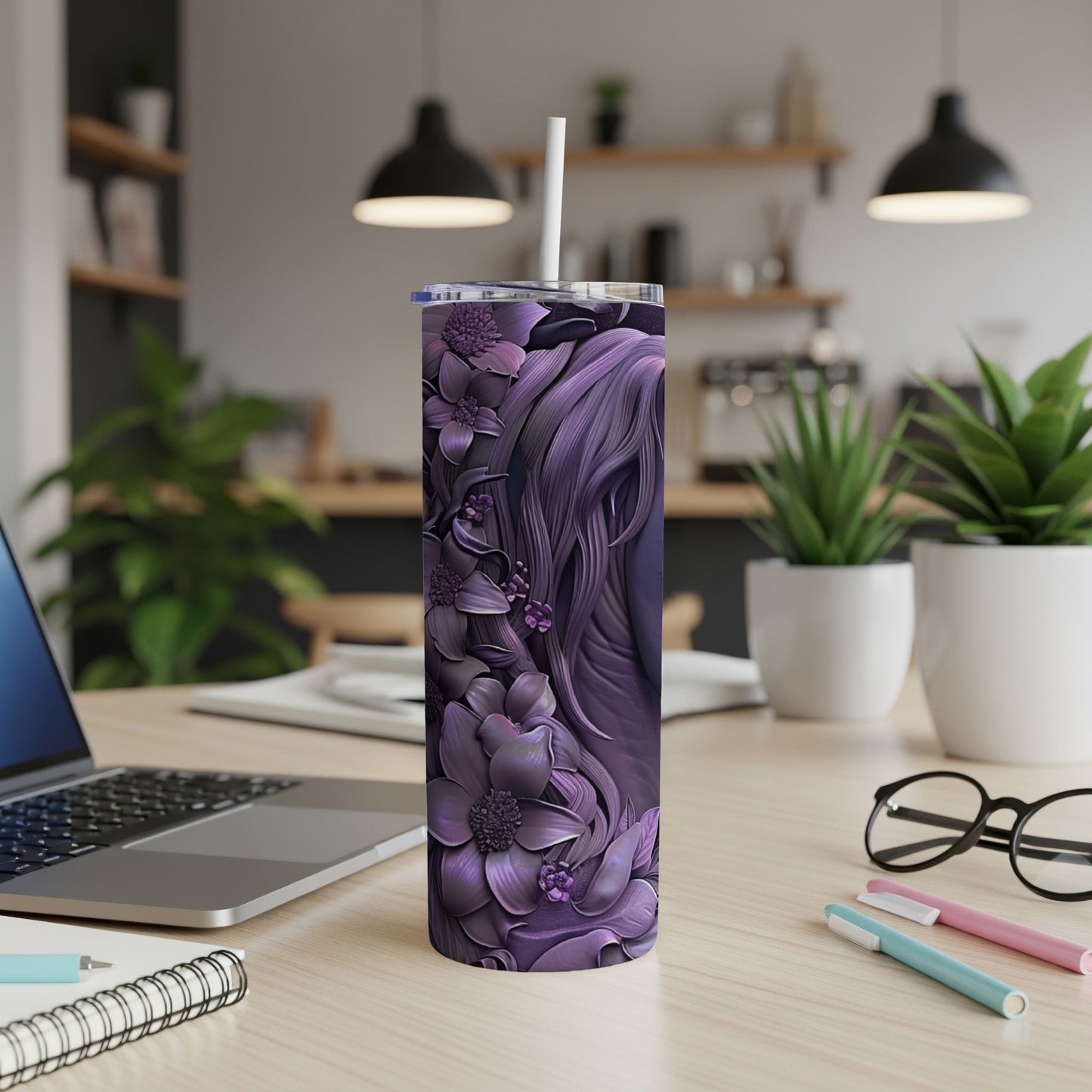 Purple tumbler with floral and hair design, straw in top.