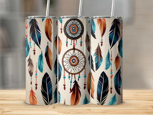 Three tumblers with a dreamcatcher and feather design on a wooden surface.