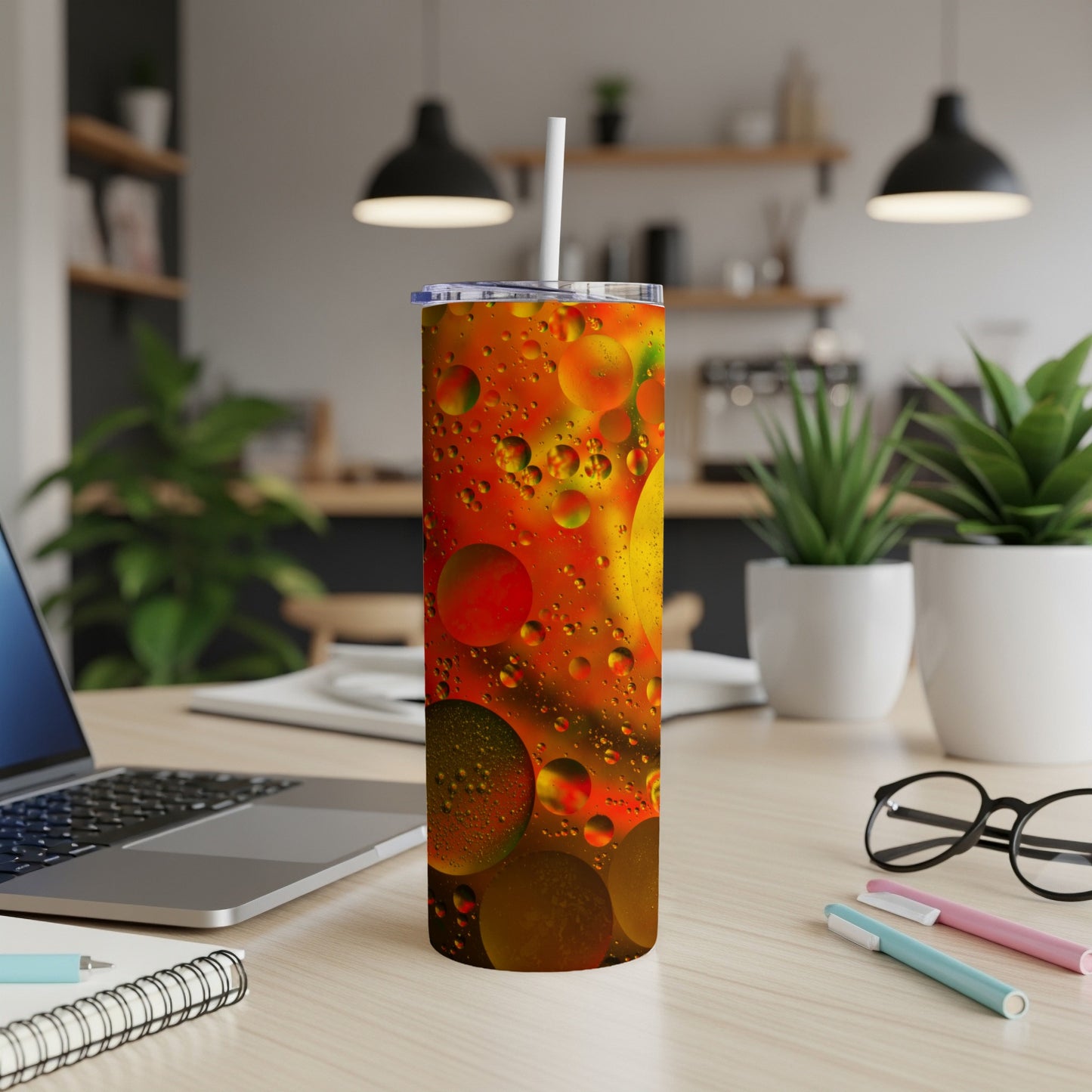 Tall tumbler with colorful oil and water bubbles design.