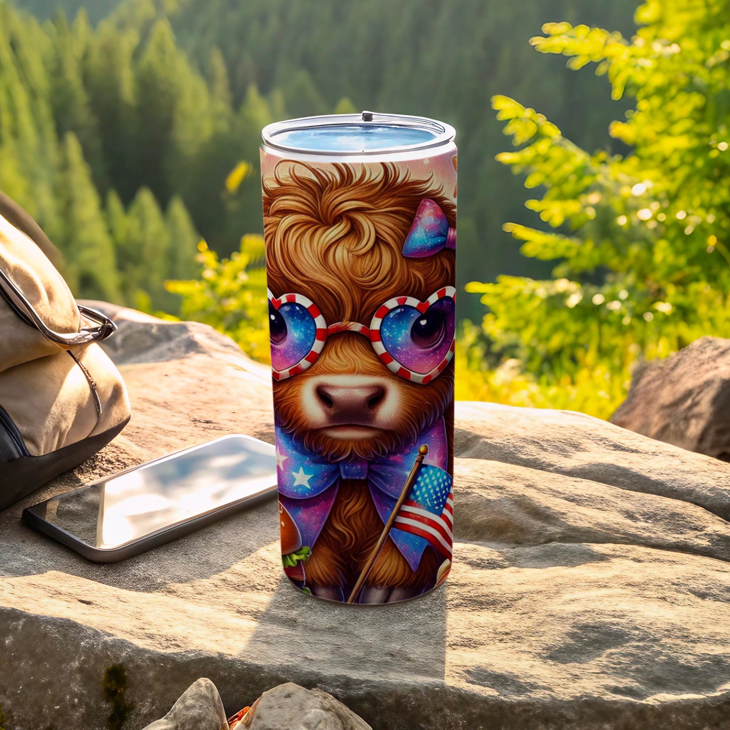 Tumbler featuring a patriotic Highland cow with heart-shaped sunglasses and bow.