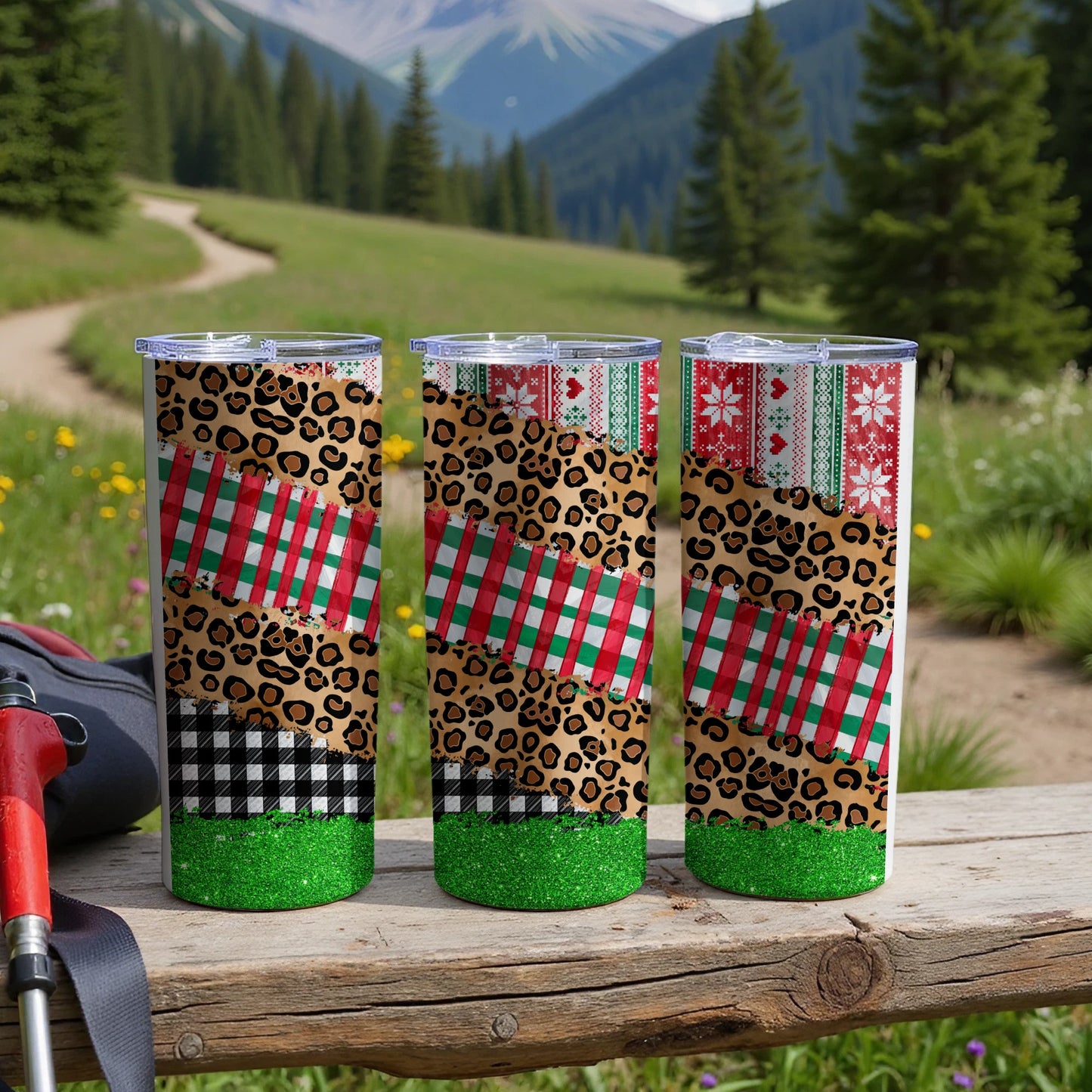 Three tumblers with leopard print, plaid, and snowflake patterns.